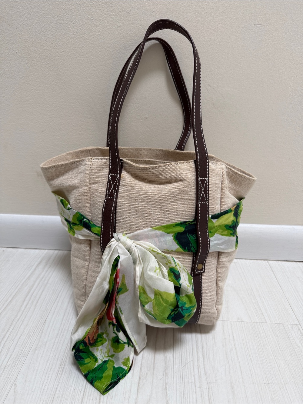 NEST Fragrances Beige Canvas Tote with Brown Handles and Green Scarf Accent